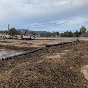 construction of paige lane neighborhood park ground view installing drainage