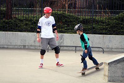 image of kid learning to skateboard at Borchard Skatepark