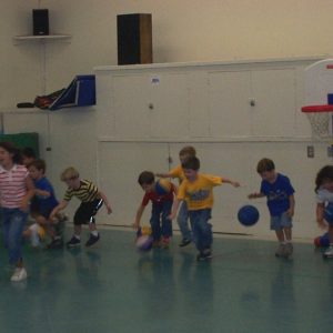 young basketball players learning to dribble