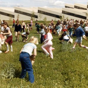The hunt is on - children make a mad dash looking for Easter eggs in the grass outside the Thousand Oaks Library, April 1982. Photograph donated by Pat Allen. LHP #02448.  We're happy to share this digital image on Flickr. Please note that certain restrictions on high quality reproductions of the original physical version may apply. For information regarding obtaining a reproduction of this image, please contact the Special Collections Librarian at specoll@tolibrary.org