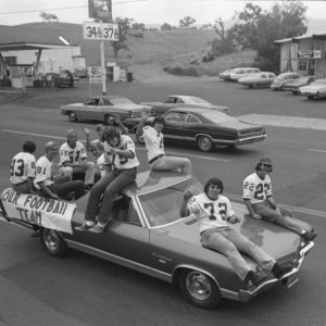 Members of the Lancer football team are all smiles during Thousand Oaks High School's homecoming parade. They are pumped and primed for the big game vs. Simi Valley High's Pioneers. News Chronicle Collection, 11-01-1972_3b_2. 

Were happy to share this digital image on Flickr. Please note that this is a copyrighted image. For information regarding obtaining a reproduction of this image, please contact the Special Collections Librarian of the Thousand Oaks Library at specoll@tolibrary.org.