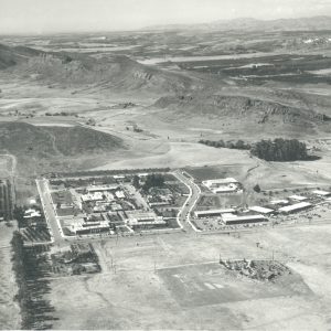 An aerial view of the California Lutheran University. Most of the area surrounding the university is undeveloped. Good view of Wildwood area in the background, with western sets still standing. Circa mid 1960s.  LHP00314.  There are no known U.S. copyright restrictions on this image. The Thousand Oaks Library requests that, when possible, the credit statement should read: "Image courtesy of Conejo Through the Lens, Thousand Oaks Library."
