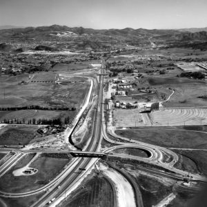 Aerial view over 101 at the Borchard/Rancho overpass, clearly shows the Drive-In Theater, Running Springs, and Thousand Oaks.  View to the southeast.  LHP03576.1  Were happy to share this digital image on Flickr. Please note that certain restrictions on high quality reproductions of the original physical version may apply. For information regarding obtaining a reproduction of this image, please contact the Special Collections Librarian at specoll@tolibrary.org.