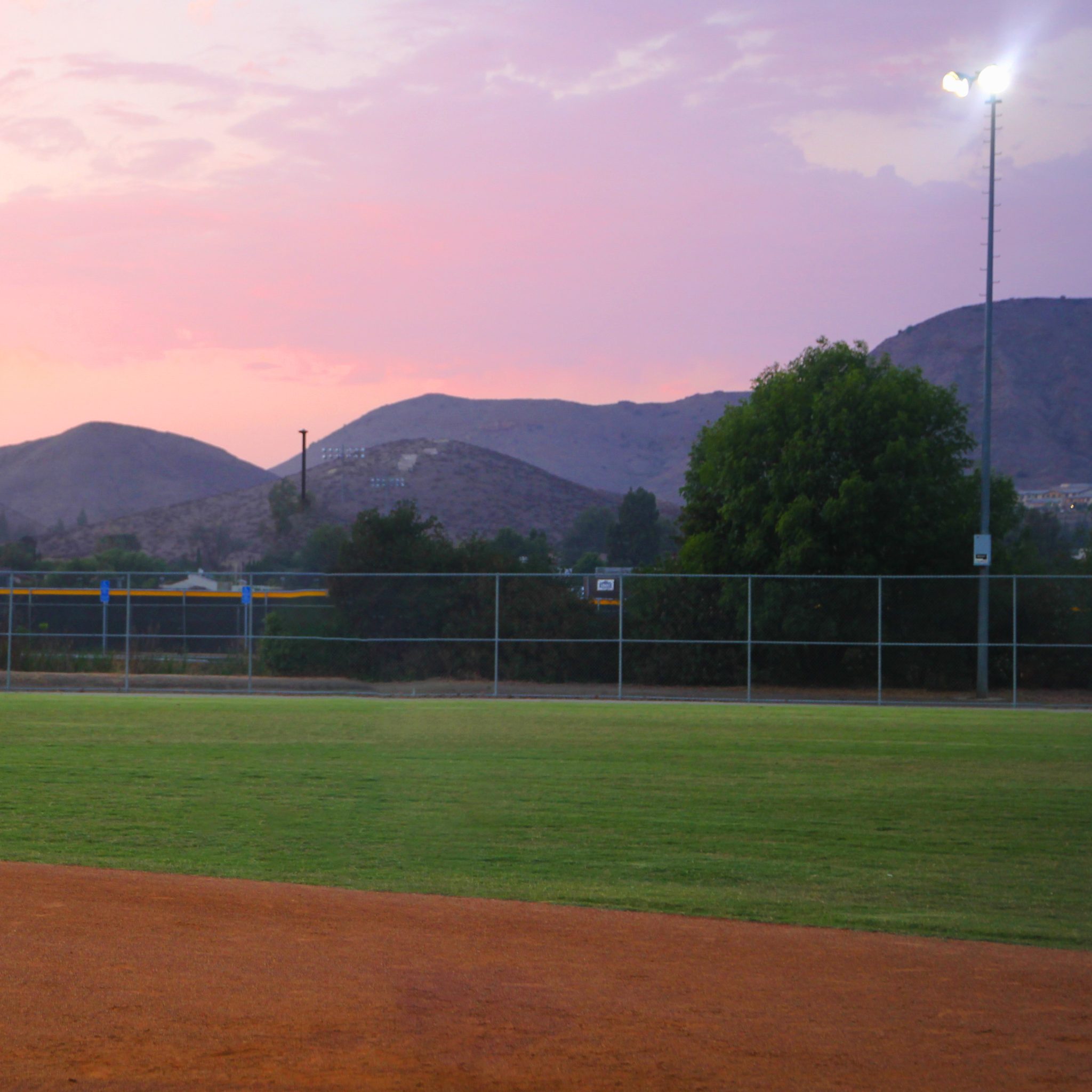 Field Conditions tab: photo of a baseball field at sunset with mountains in the background
