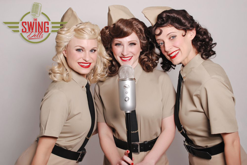 image of the swing dolls pose behind a microphone